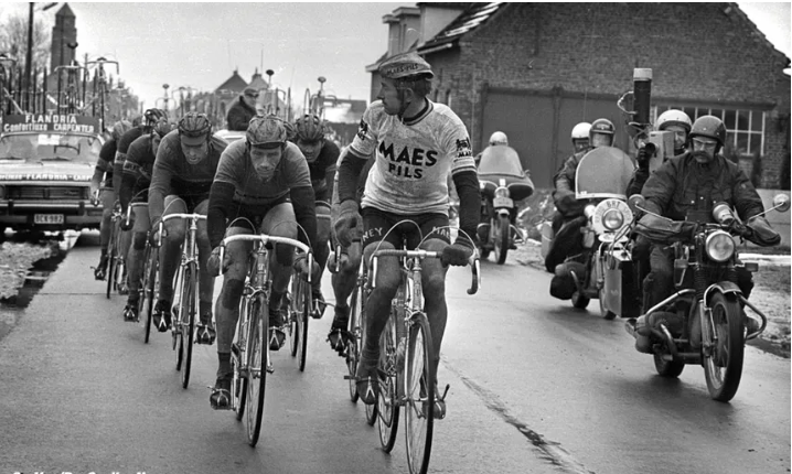 Belgian cycling peloton escorted by motorcycles